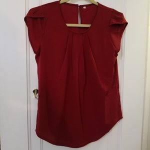 Red blouse with cuffed sleeves